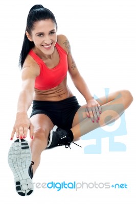 Pretty Woman Doing Stretching Exercise Stock Photo