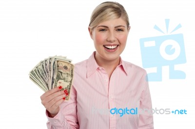 Pretty Woman Holding Fan Made Of Money Stock Photo