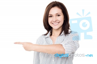 Pretty Woman Pointing In Different Direction Stock Photo