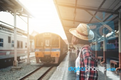 Pretty Woman Waiting The Train At Train Station For Travel In Su… Stock Photo