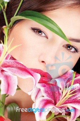 Pretty Woman With Flowers Stock Photo