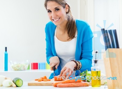 Pretty Young Woman Cooking At Home Stock Photo