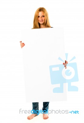 Pretty Young Woman Holding A White Banner Stock Photo