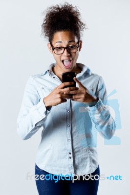 Pretty Young Woman Using Her Mobile Phone Stock Photo