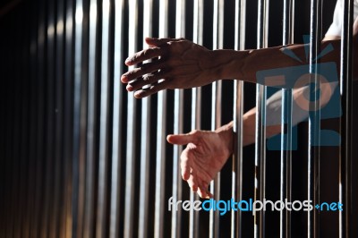 Prisoner In Jail Stock Photo