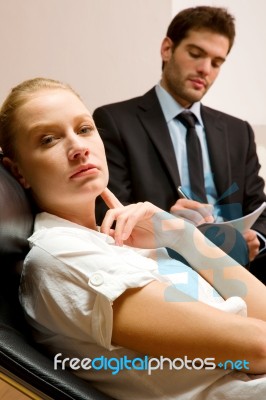 Psychiatrist Examining A Female Patient Stock Photo