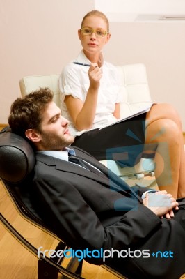 Psychiatrist Examining A Male Patient Stock Photo