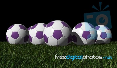 Purple Soccer Balls On A Green Grass Stock Image