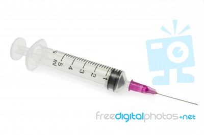 Purple Syringe On White Background Stock Photo