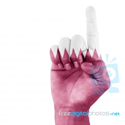 Qatar Flag On Pointing Up Hand Stock Photo