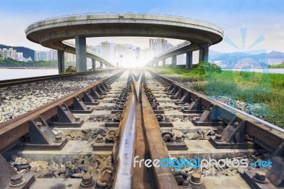 Railways Track And Bridge Cross Over With Urban Scene Behind Use… Stock Photo