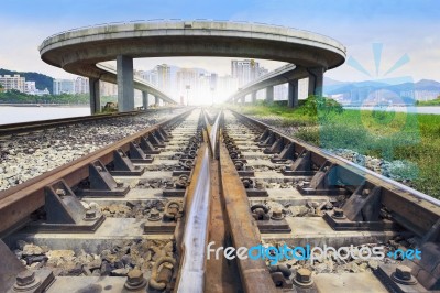 Railways Track And Bridge Cross Over With Urban Scene Behind Use… Stock Photo