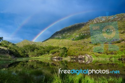 Rainbow Over Mountain Stock Photo