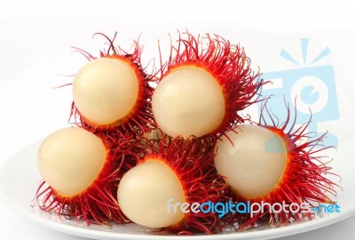 Rambutan Fruit On Plate Stock Photo