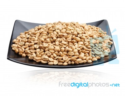 Raw Coffee Seeds On Dish Stock Photo