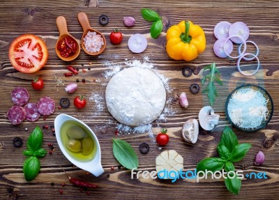Raw Dough With Ingredients For Homemade Pizza On Shabby Wooden B… Stock Photo