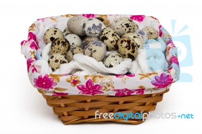 Raw Quail Eggs Inside A Wicker Basket Stock Photo