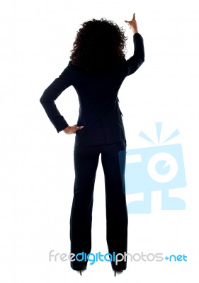 Rear View Of Lady Pointing up Stock Photo