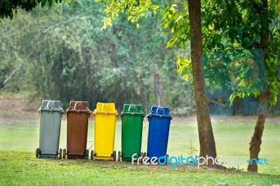 Recycle Bins In Garden Stock Photo