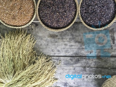 Red And Black Organic Brown Rice In  Round Rattan Woven Basket Stock Photo