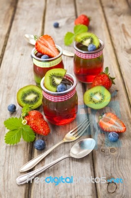 Red And Green Jelly Served With Fruit Stock Photo