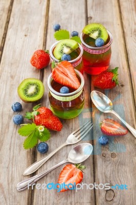 Red And Green Jelly Served With Fruit Stock Photo