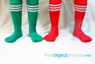 Red And Green Socks For Christmas Holidays Stock Photo