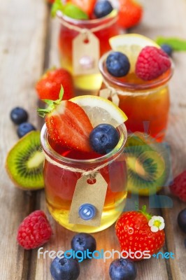 Red And Yellow Jelly Served With Fruit Stock Photo