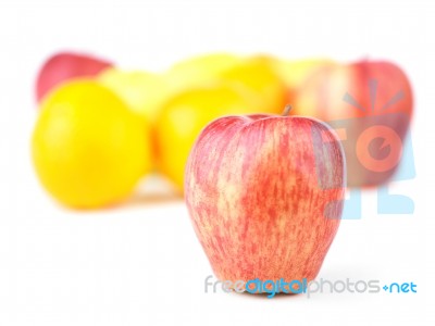 Red Apple And Fruit Blurred Group Stock Photo