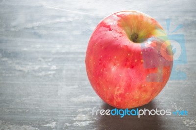 Red Apple On The Table Stock Photo