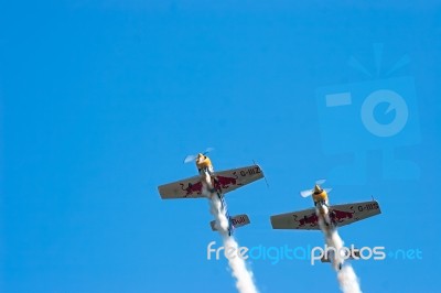 Red Bull Stunt Planes At The Shoreham Airshow Making Smoke Stock Photo