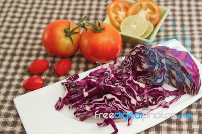 Red Cabbage Slice On White Plate With Fresh Vegetable Stock Photo