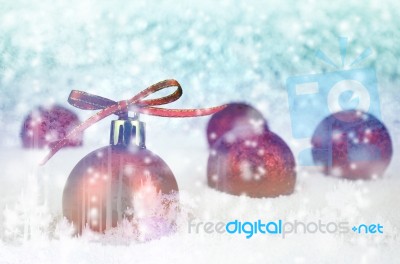 Red Christmas Ball With Bokeh In Blue Moontone Stock Photo
