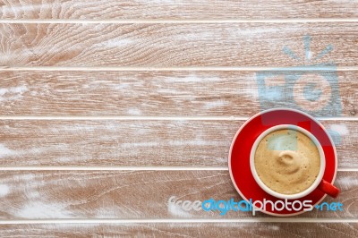 Red Cup Of Coffee On Wood Background Stock Photo