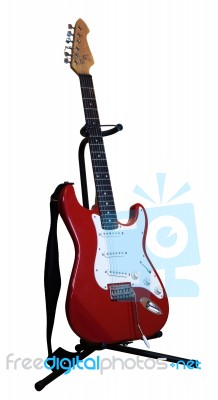 Red Electric Guitar On A Stand Stock Photo