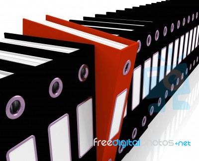 Red File Amongst Black Stock Image