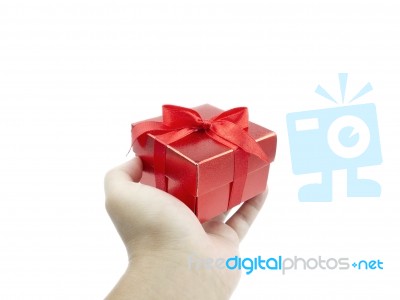 Red Gift Box In Human Hand Stock Photo