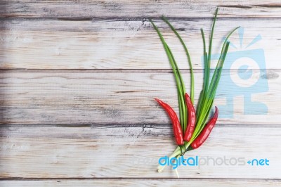 Red Hot Chilli Pepper And Green Onion Stock Photo