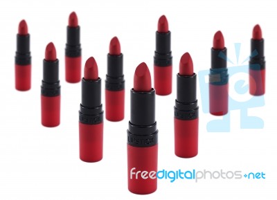 Red Lipsticks Army In White Background High Key Stock Photo