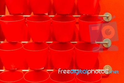 Red Plastic Cup Display On Wall Stock Photo