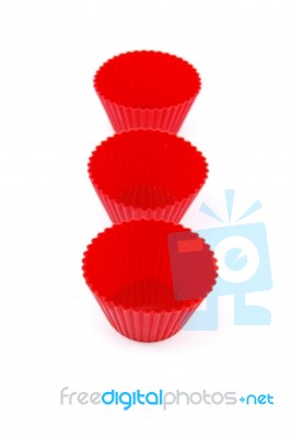 Red Plastic Cups For Small Cakes On White Stock Photo