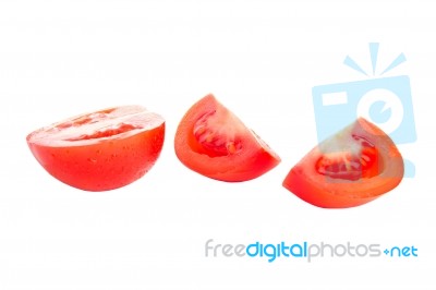 Red Sliced Isolated Tomatoes With Water Drops Stock Photo