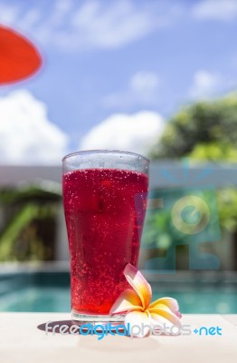 Red Soda Water At Poolside In Summer Sunny Day Stock Photo
