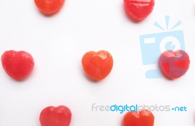 Red Valentine's Day Heart Shape Candy Pattern On Empty White Paper Background. Love Concept. Colorful Hipster Style. Knolling Top View Stock Photo