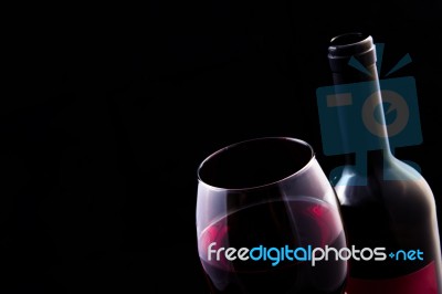 Red Vine In Glass And Open Bottle Stock Photo