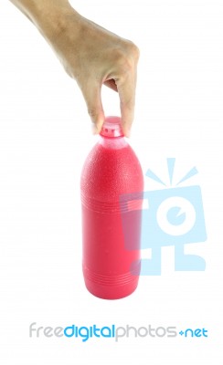 Red Water Bottle In Grasp Finger Hand On White Background Stock Photo