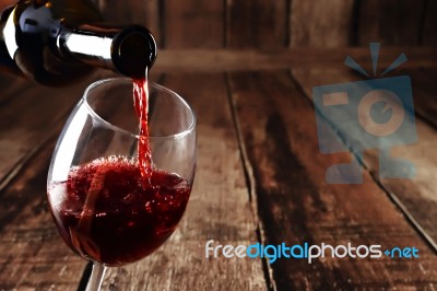 Red Wine Pour  From Bottle Stock Photo