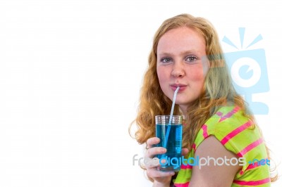 Redhead Girl Drinking Blue Soft Drink Stock Photo