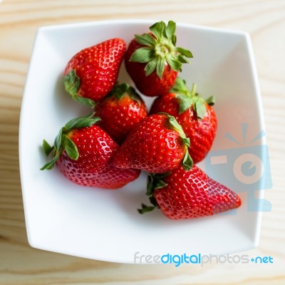 Ripe Red Strawberries On A Plate Stock Photo