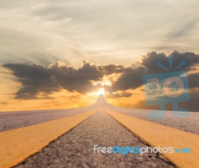 Road Asphalt Suspended To Sunset Stock Photo